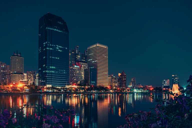 Bangkok skyline at night with water reflections for a Bangkok stay guide