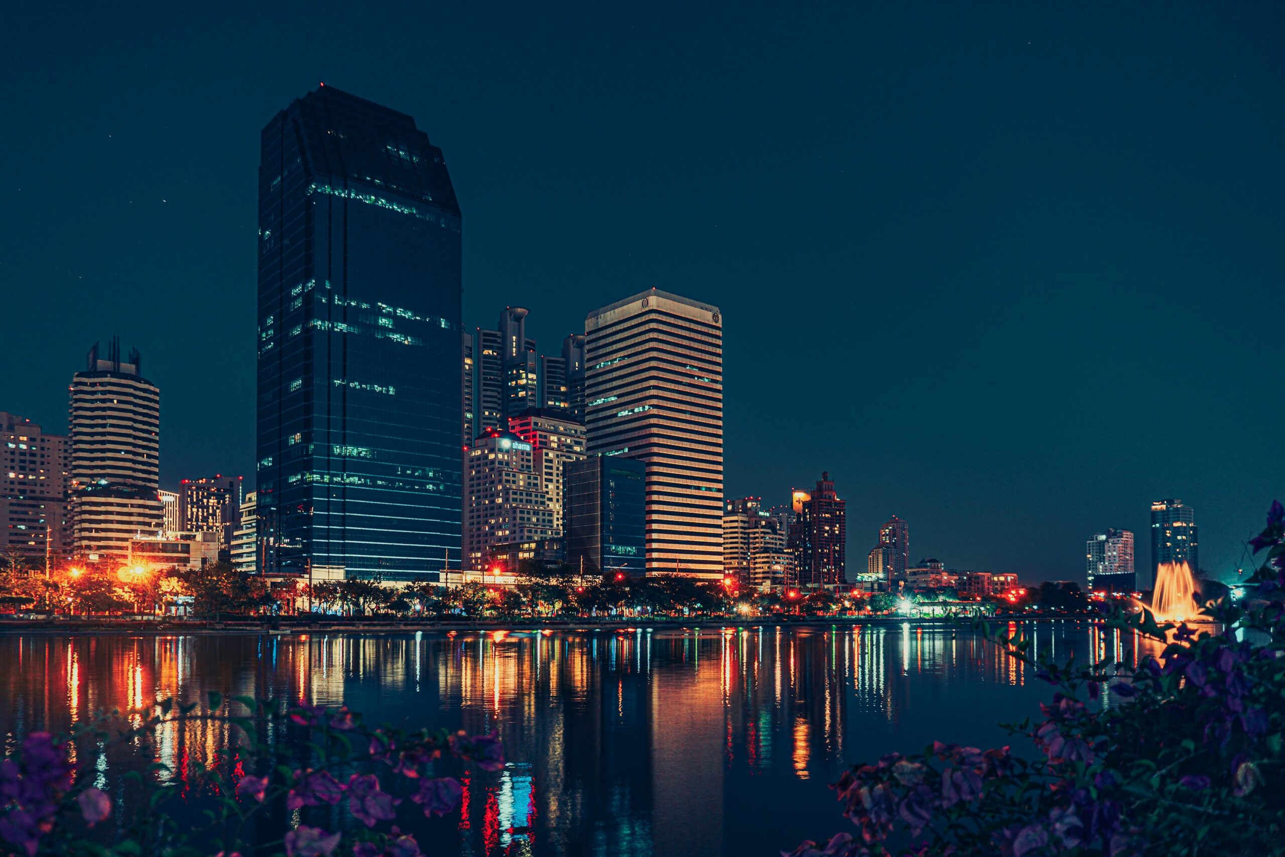Bangkok skyline at night with water reflections for a Bangkok stay guide